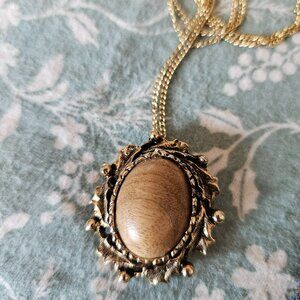 A golden wood cabochon broach necklace combo